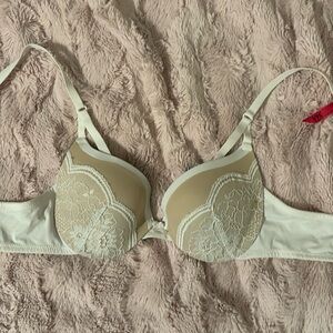 White and tan, lace in the front, adjustable straps, 34A